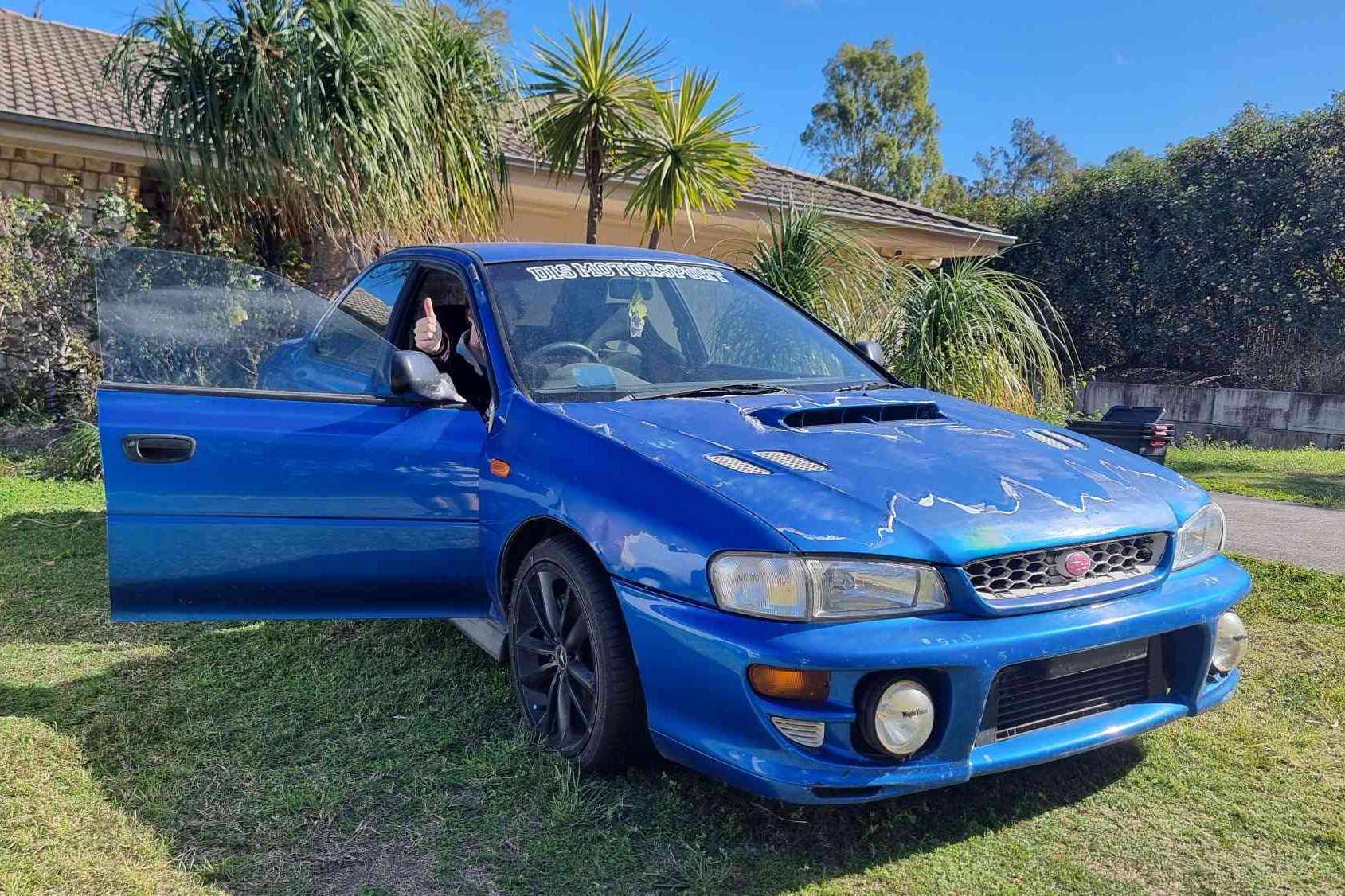 1999 Subaru WRX GC8 as bought, parked on the front lawn